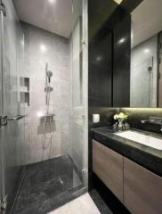 Modern bathroom with glass shower and vanity