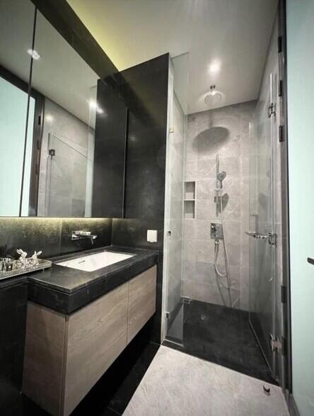 Modern bathroom with glass shower and vanity