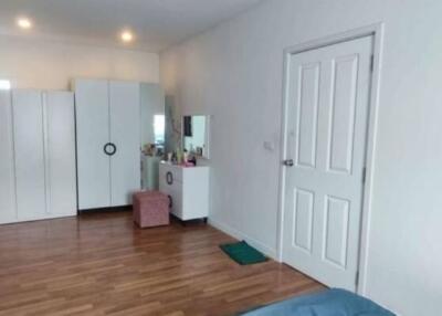 Spacious bedroom with wardrobes and dressing table