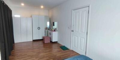 Spacious bedroom with wardrobes and dressing table