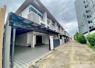 Modern townhouse exterior with driveway