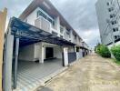 Modern townhouse exterior with driveway