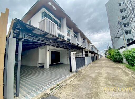 Modern townhouse exterior with driveway