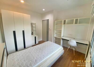 Modern bedroom with study desk and wardrobe