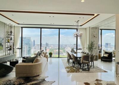 Spacious open-plan living and dining area with city views