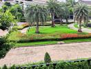 Beautifully landscaped garden with palm trees and vibrant flowers