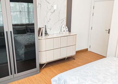 Modern bedroom with wardrobe and dresser