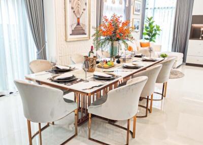 Elegant dining room with a modern table set and floral centerpiece