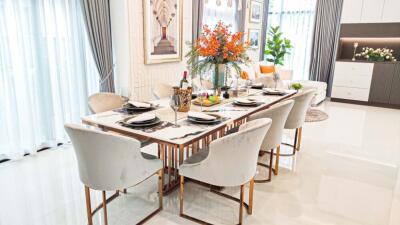 Elegant dining room with a modern table set and floral centerpiece