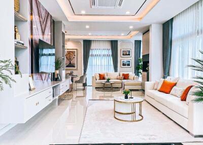 Modern living room with stylish decor and ample natural light