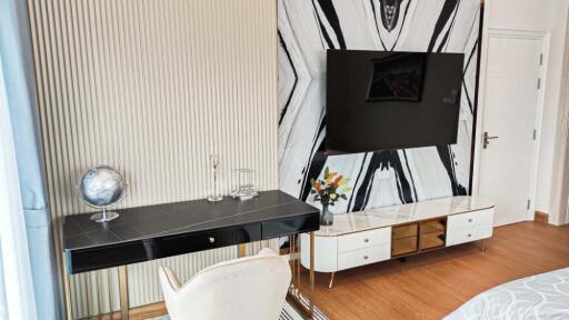 Modern living space with TV and desk