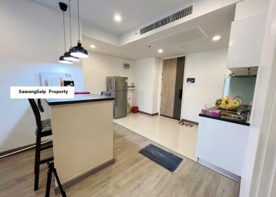 Modern kitchen with bar counter and pendant lights