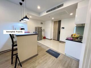 Modern kitchen with bar counter and pendant lights