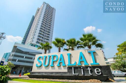 Exterior view of Supalai Lite condominium with a tall building in the background