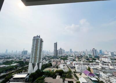 Cityscape view from a high-rise balcony