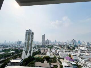 Cityscape view from a high-rise balcony