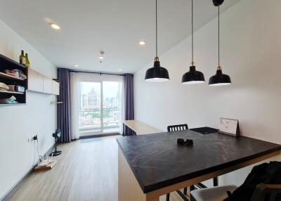 Modern living area with dining table and city view