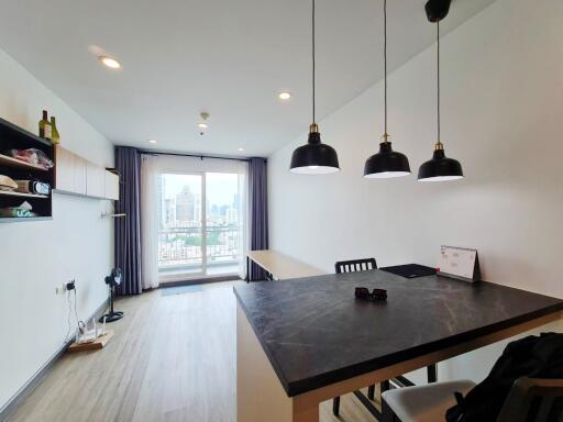 Modern living area with dining table and city view