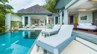 Outdoor pool area with lounge chairs and view of bedroom and living space