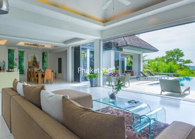 Modern living area with open layout and pool view