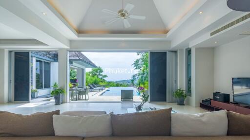 Modern living room with a view of the pool and garden