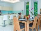 Modern dining area with a view of the fully equipped kitchen