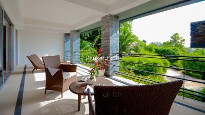 spacious balcony with outdoor furniture and lush green view