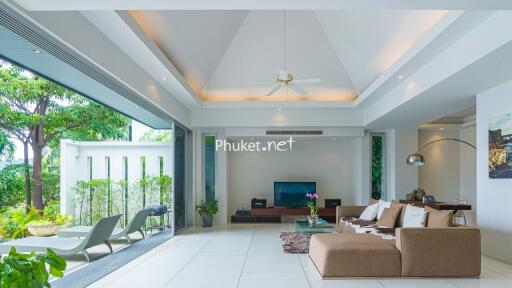 Spacious and modern living room with large windows and outdoor access