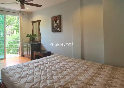 Bedroom with large window and natural light