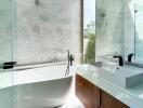 Modern bathroom with freestanding bathtub and white countertop sink