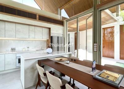 Modern kitchen and dining area with large windows