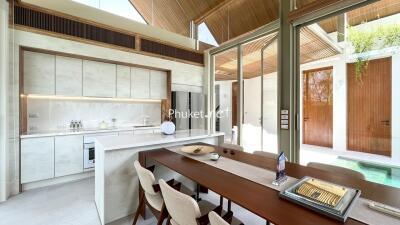 Modern kitchen and dining area with large windows