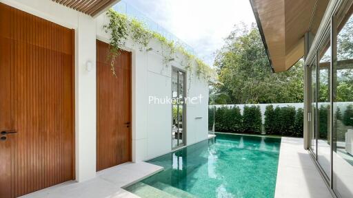 Modern outdoor area with pool and greenery