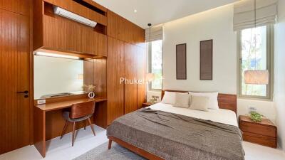 Spacious and modern bedroom with wooden furniture