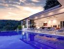 Luxurious home with a stunning outdoor pool area at sunset