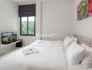 Modern clean bedroom with twin beds and a scenic view