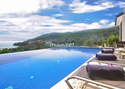 Infinity pool with sea and mountain views