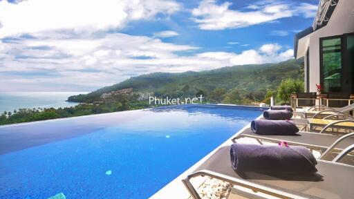 Infinity pool with sea and mountain views