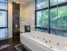 Modern bathroom with large bathtub and walk-in shower