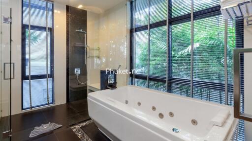 Modern bathroom with large bathtub and walk-in shower