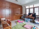 Children's playroom with various toys and wooden cabinetry