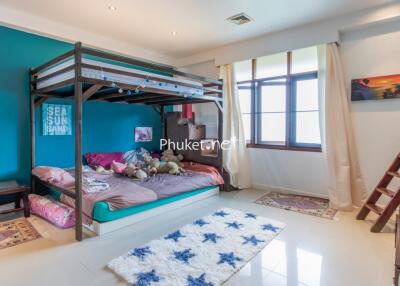 Spacious bedroom with bunk bed and large window