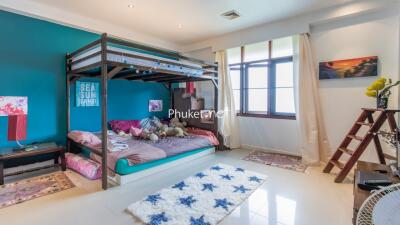 Spacious bedroom with bunk bed and large window