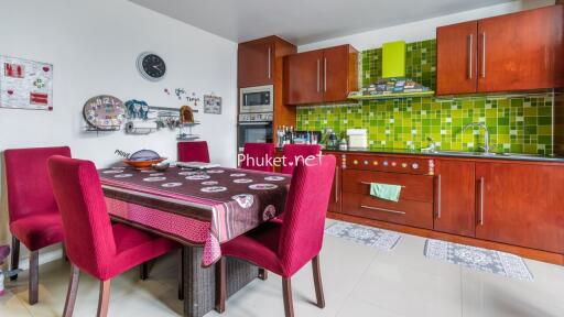 Modern kitchen with wooden cabinets and dining area