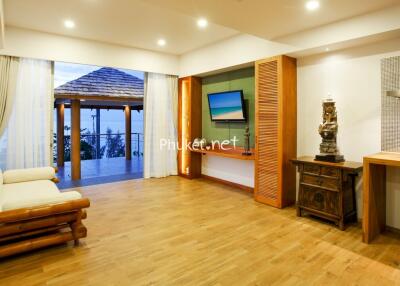 Spacious living room with wooden floor and modern decor