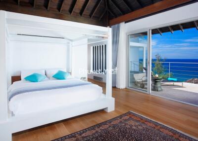 Spacious bedroom with ocean view and modern decor