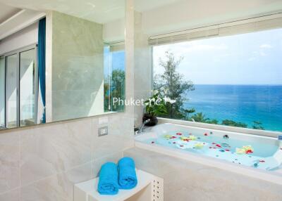 Luxurious bathroom with ocean view and a jacuzzi