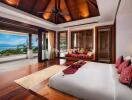 Spacious bedroom with large windows and ocean view