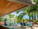 Outdoor patio with dining area, pool, and ocean view