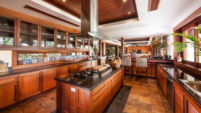 Spacious modern kitchen with wooden cabinets and island